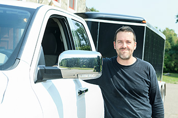 Man standing by truck