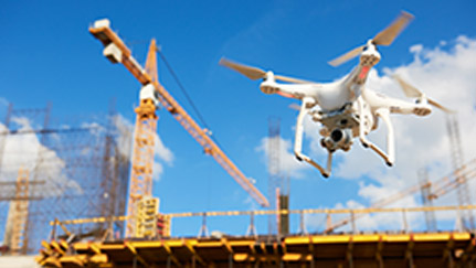 Drone flying around construction site