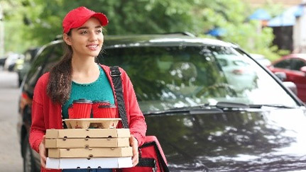 woman carrying food and drink containers