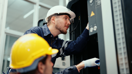 Workers checking electrical systems